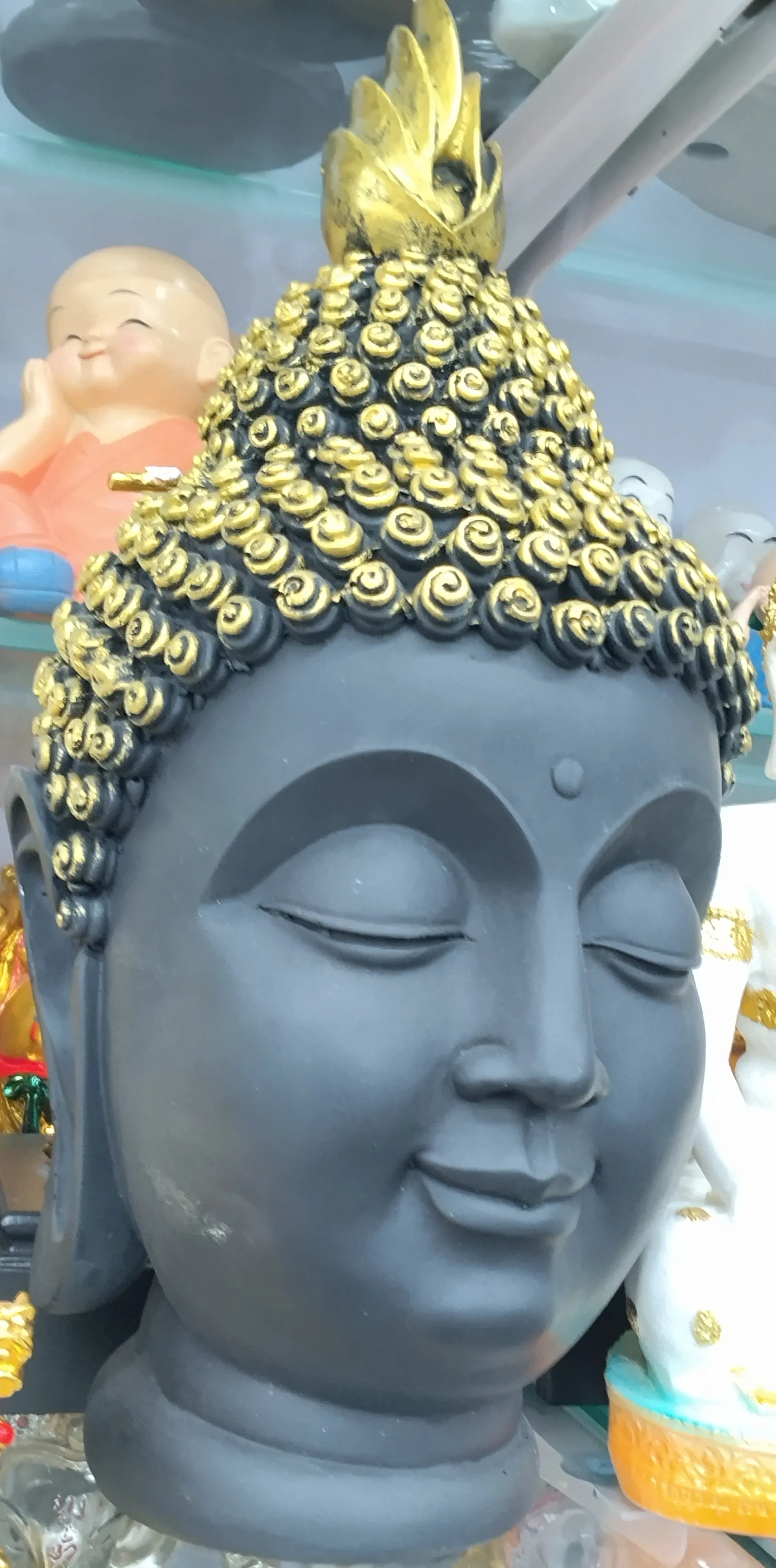 Black and Gold Buddha Head Statue view 2
