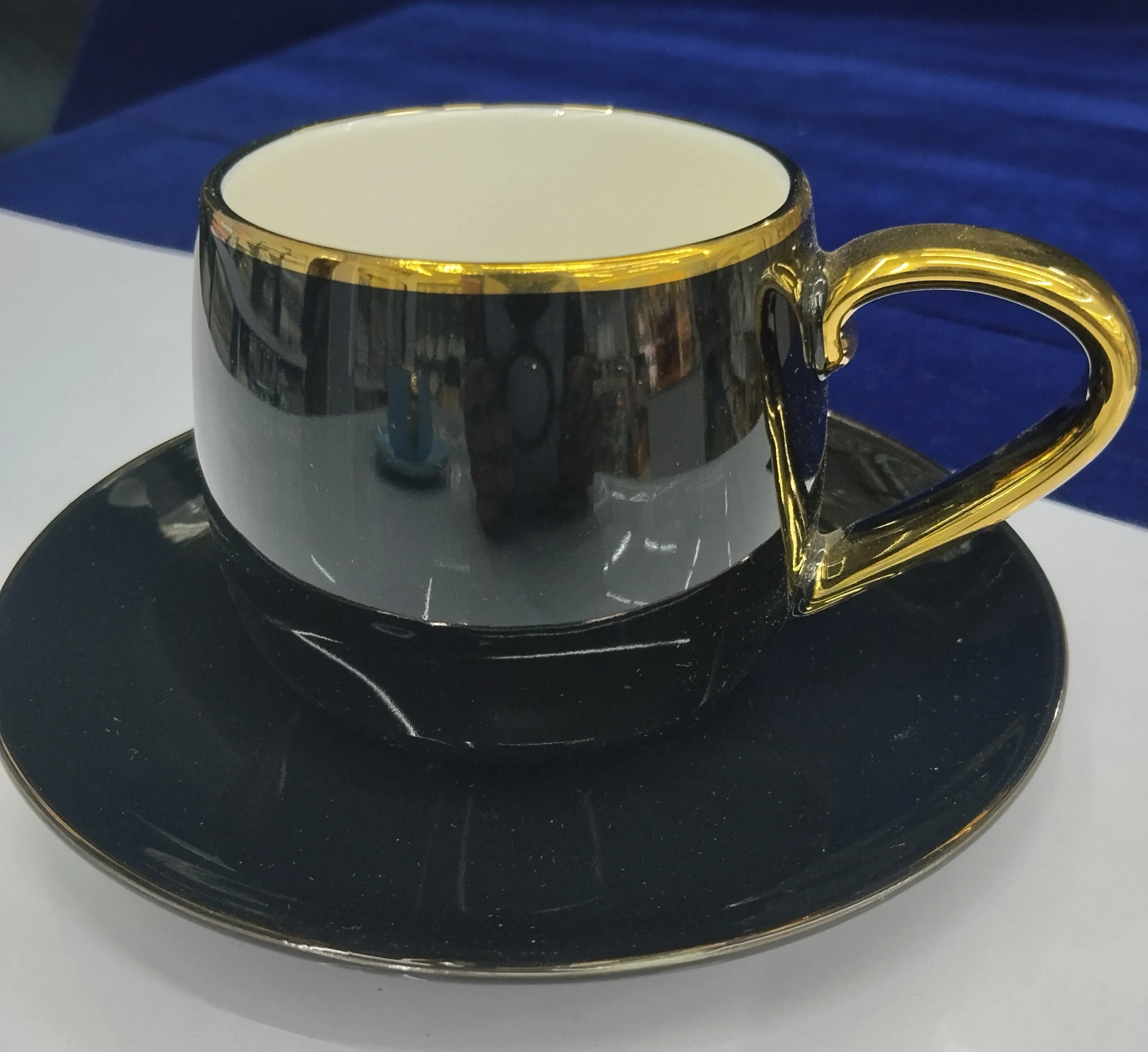 Elegant Black and Gold Cup and Saucer view 2